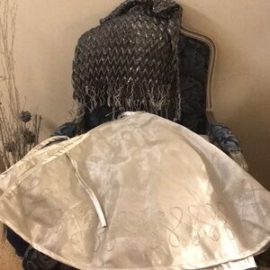 Beautiful Christmas tree skirt. Silver with sparkling silver trim.